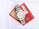Omega Seamaster GMT Chronometer luxury watch with certification card and documentation.