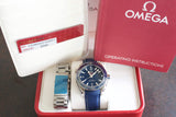 Omega Seamaster Planet Ocean luxury watch with blue strap, extra bracelet, box, and documents