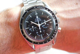 Vintage Omega Speedmaster Professional Moonwatch with black dial and steel bracelet on wrist