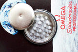 Open caseback of Omega Speedmaster Professional Moonwatch showing inner markings