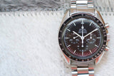 Omega Speedmaster Professional Moonwatch chronograph with black dial and stainless steel bracelet
