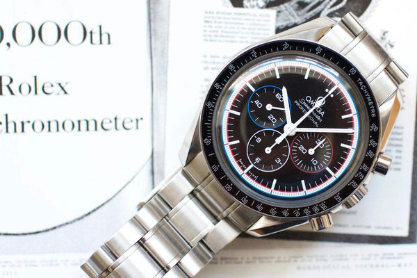 Stainless steel Omega Speedmaster Professional chronograph with black dial and tachymeter bezel