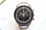 Omega Speedmaster Professional Moonwatch chronograph with stainless steel bracelet and black dial