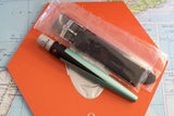 Omega replacement watch strap and green tool on orange box, luxury watch accessories