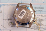 Back of a limited edition Swiss chronograph watch with barcode, placed on a map