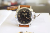 Luxury Panerai Luminor wristwatch with brown leather strap on white background