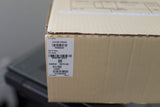 Close-up of a cardboard box with Panerai PAM00424 watch model label and barcodes.