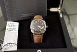 Luxury Swiss watch with brown leather strap in presentation box, black dial, Roman numerals