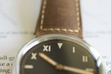 Close-up of luxury watch with California dial and brown leather strap