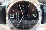 Close-up of Panerai Radiomir watch with black dial, luminous markers, and leather strap
