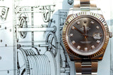 Rolex Oyster Perpetual Datejust luxury watch with diamond hour markers on a technical drawing background