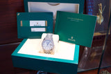 Pre-owned Rolex Oyster Perpetual Datejust luxury watch with original green box and papers