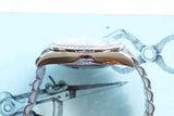 Side view of a luxury diamond-encrusted watch with a polished silver link bracelet