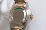 Back view of a two-tone luxury watch featuring a stainless steel case and gold accents.
