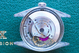 Close-up of the internal mechanical movement of a luxury Swiss watch.