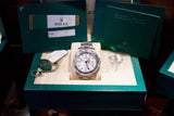 Pre-owned Rolex luxury watch with original box, warranty booklet, and certification.