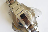 Close-up of stainless steel Swiss-made watch bracelet and clasp with engraved crown logo