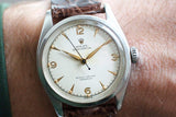 Vintage Rolex Oyster Perpetual Bubble Back 6084 luxury watch with cream dial and leather strap