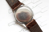 Vintage luxury watch case back with brown leather strap on technical drawing background