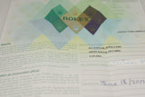 Close-up of official Rolex warranty certificate with distributor and purchase details