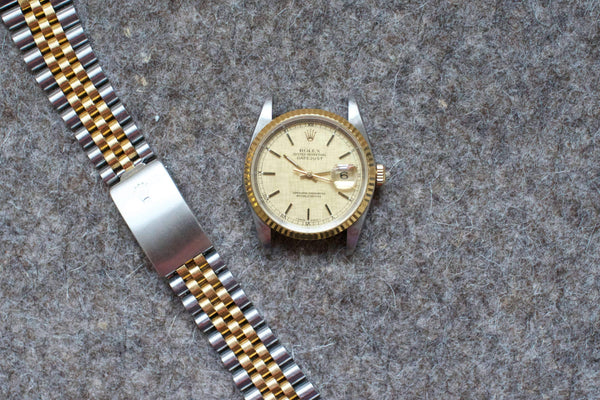 SOLDOUT: Rolex DateJust 36mm LINEN DIAL 18K Two-Tone HOLES Champagne Jubilee Watch 16233
