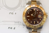 Vintage two-tone luxury Swiss watch with brown and gold bezel on technical drawing background