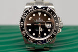 Luxury stainless steel GMT watch with black dial, date window, and two-tone bezel