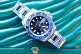 Rolex Oyster Perpetual Date luxury watch with blue bezel on green leather background