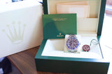 Rolex GMT-Master II luxury watch with original green box, manual, and seal.