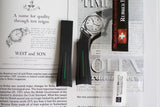 Rubber watch straps with green accents for Rolex Milgauss on vintage advertisement background
