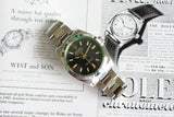 Stainless steel Rolex Milgauss luxury watch with black dial on vintage magazine background