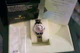 Women's luxury Swiss-made watch with silver bracelet displayed in original box with documents