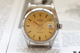 Vintage Rolex Oysterdate Precision 6694 stainless steel watch with champagne dial and date display