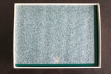 Top view of a luxury watch presentation box with textured foam insert and gold crown logo