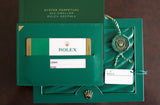 Rolex Sea-Dweller 126600 green box with guarantee card, booklet, and Geneva tag
