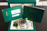 Rolex Sea-Dweller 126600 stainless steel watch with box, papers, and accessories.