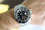 Stainless steel Rolex Sea-Dweller 126600 luxury watch with black dial on wrist