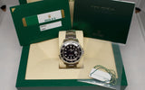 Stainless steel Rolex Sea-Dweller watch with black dial in original box, warranty card and tags