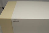 Close-up of beige and white watch box labeled 'Oyster L SAP 39141'