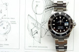 Rolex Submariner luxury watch with black dial and bezel on a technical clock drawing background