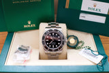 Stainless steel Swiss luxury dive watch with black bezel and dial in original box