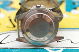 Close-up of vintage stainless steel Swiss watch case back without bracelet