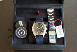 Chronograph watch with fabric strap, extra metal bracelet, and accessories in display box