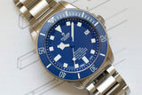 Blue dial Tudor Pelagos titanium dive watch with date display and stainless steel bracelet