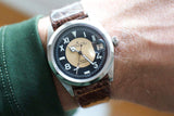Vintage Tudor Prince Oysterdate California dial watch with brown leather strap on wrist