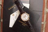 Vacheron Constantin luxury watch with brown leather strap on branded black packaging