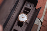 Vacheron Constantin luxury watch with brown leather strap in a grey velvet display box