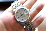 Silver Tudor Prince Date luxury watch with a textured dial on a person's wrist