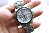 Close-up of a pre-owned TAG Heuer chronograph luxury watch with a silver steel bracelet.
