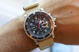 Zenith El Primero Autovintages luxury watch with a tan fabric strap on a wrist